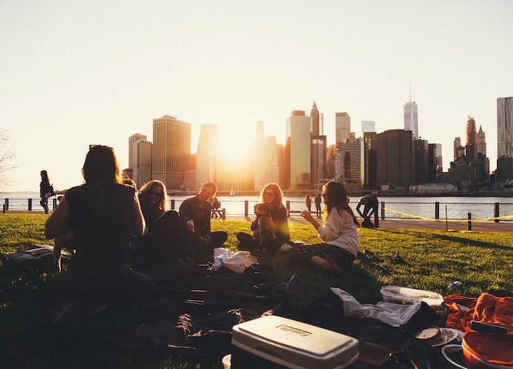 colivers enjoying a sunset in the park overlooking the skyline