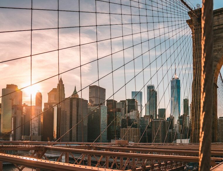 View of the New York City skyline from the Brooklyn Bridge when searching for cafes to work in NYC with a laptop