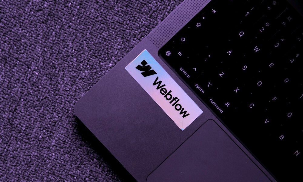 Weflow co-code web development logo on laptop