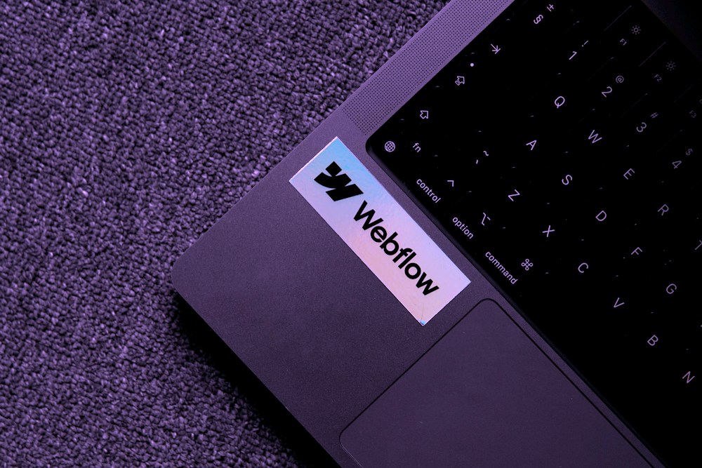 Weflow co-code web development logo on laptop