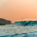 Surfing in Portugal sunset