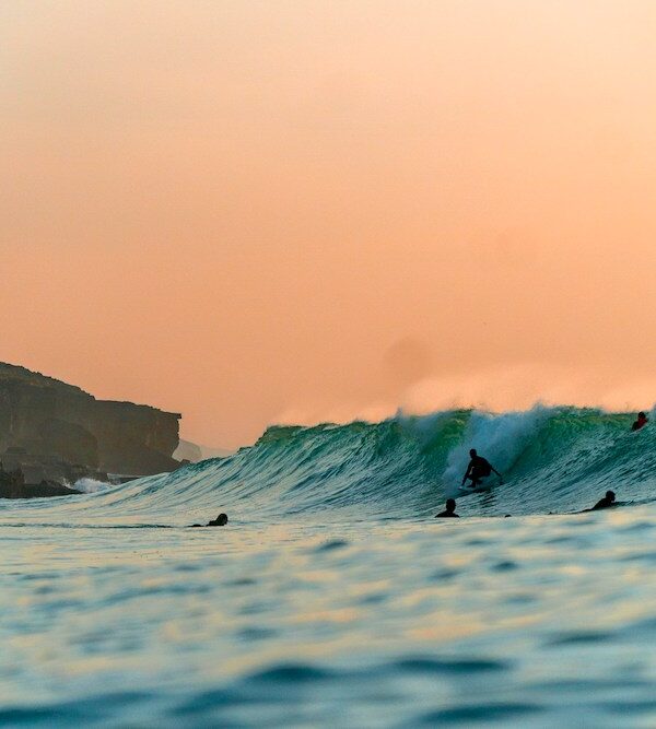 Surfing in Portugal sunset