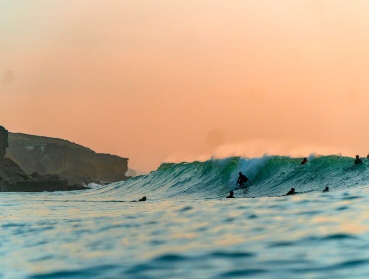 Surfing in Portugal sunset