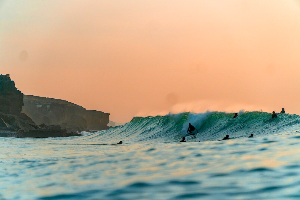 Surfing in Portugal sunset